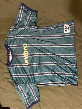 Umbro Men’s Teal Striped Short Sleeve Jersey with Yellow Logo